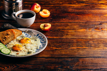 Breakfast toast with fried eggs with vegetables, fruits and coff