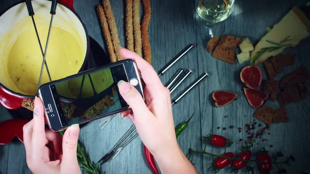 4k Mixed Cheese Fondue Taking Picture on Smartphone