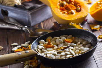 pumpkin seeds grain harvest vitamins vegetables wooden background
