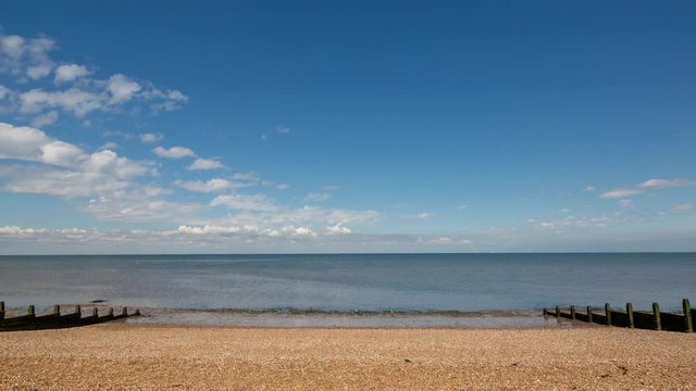 Time lapse of a pebble beach in whistable, kent, england on a summer's day