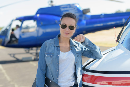 young beautiful woman helicopter pilot
