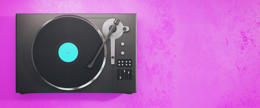 Vinyl record player on pink background