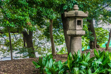 Traditional Japanese stone lantern in the garden, Japan.
