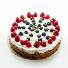 festive berries cake, white background