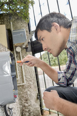 man fixing meter