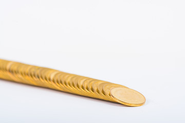 Columns of gold coins, piles of coins on white background