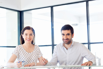 Fototapeta premium Image of two young business people in office