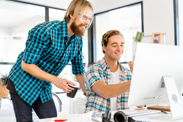 Fototapeta premium Two office workers at the desk