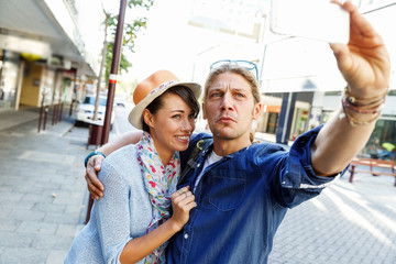 Smiling couple with the camera