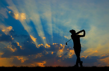 Fototapeta na wymiar silhouette golfer playing golf during beautiful sunset