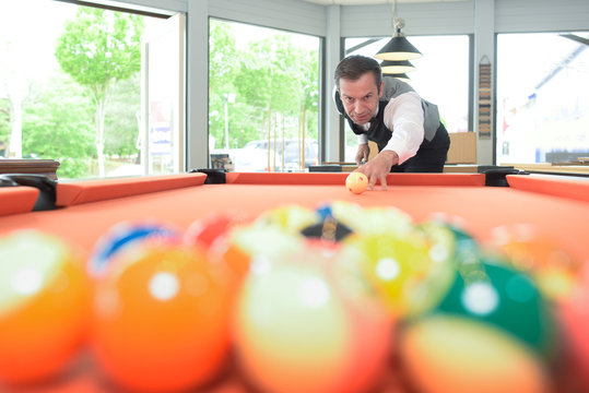 Man Poised To Break At Pool Table