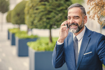 Smart senior business man, an elderly entrepreneur and business, having a pleasant business...