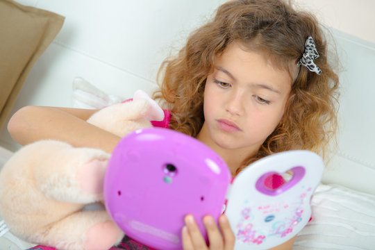 Girl Playing Electronic Toy