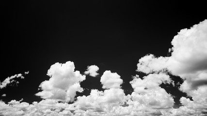 Black sky and white clouds