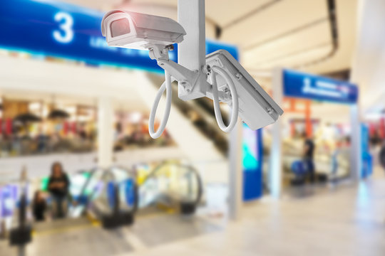 CCTV Security Camera Shopping Mall On Blurry Background.