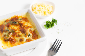 Spinach with cheese on plate.