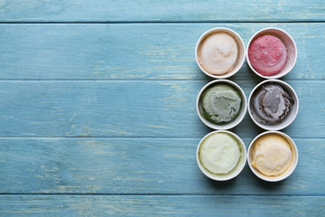 Top view of Ice cream flavors in cup and topping, sweet and dessert food concept