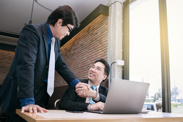 businessman coaching with boss and discussion thinking for working on notebook, working together as...