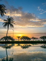 Fototapeta na wymiar Twilight sunrise sky at sea with pool