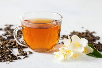 Cup of tea with jasmine flowers