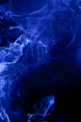Blue smoke on a black backgroug.