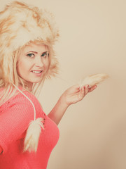 Attractive woman wearing furry winter hat