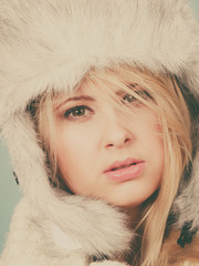 Blonde woman in winter warm furry hat