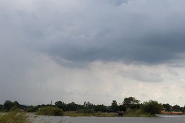 Fototapeta na wymiar Cloudy sky over rural watershed.