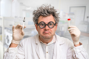 Scientist with gray hair performing experiments in laboratory