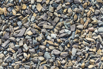 background of small rough stones for paving a way