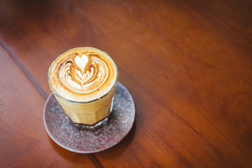 Coffee cup on wooden table.