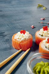 Menu of Japanese sushi rolls on black background