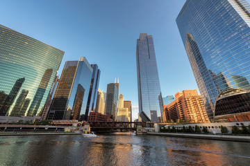 Fototapeta na wymiar Chicago City. Chicago downtown and Chicago River with bridges during sunset.