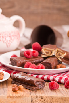 Chocolate rolls with hazelnuts and raspberries.