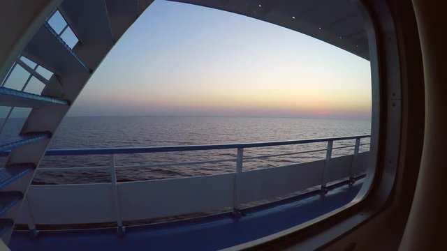 Evening view from the window of river sea luxury cruise ship boat. Best Russian nature tourism. After sunset calm water reflection