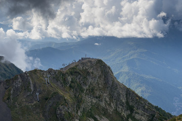 Fototapeta premium mountain landscape on the background of blue sky with clouds with the types of cable car