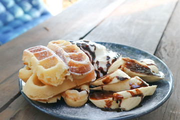 waffle with banana and whipped cream dish