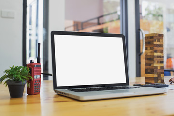 Fototapeta premium Conceptual workspace, Laptop with blank screen on table