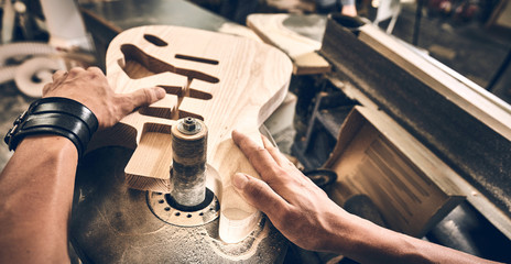 Manufacture of guitars of the brand Woodstock. - obrazy, fototapety, plakaty