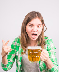Emotional fan with a beer. Woman with a mug of beer