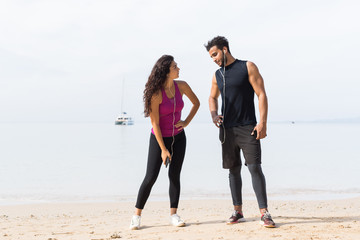 Couple Of Runner Having Rest After Training On Beach Man And Woman Sport Runners Standing Fit Male And Female Fitness Jogger On Seaside Together