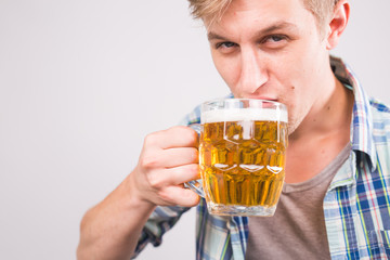 Close up of man holding a mug of beer.