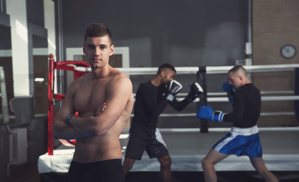 Male boxers. Taking a box in the gym. Male kind of relaxation. Sports training.