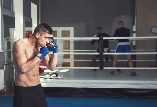 Male boxers. Taking a box in the gym. Male kind of relaxation. Sports training.