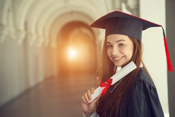 Woman student in graduation cap with certificate. Happy woman on her graduation day University....