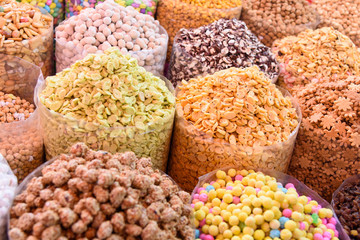 Nuts and dried fruits in large bags on market. Morocco