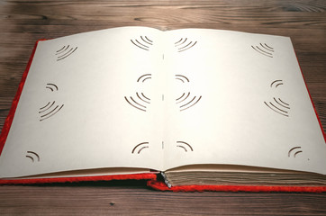 Old retro open photo album book with copy space for image or text on burnt table surface background.