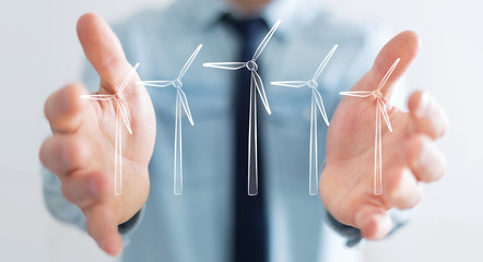 Businessman holding renewable energy sketch