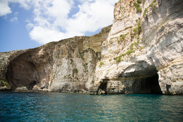 Fototapeta na wymiar Blue Grotto, famous rock formations and caves attraction at Malta sea shore