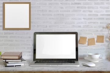 Stylish workspace with laptop computer, office supplies  at home or studio office. Mock up blank screen for graphic montage.